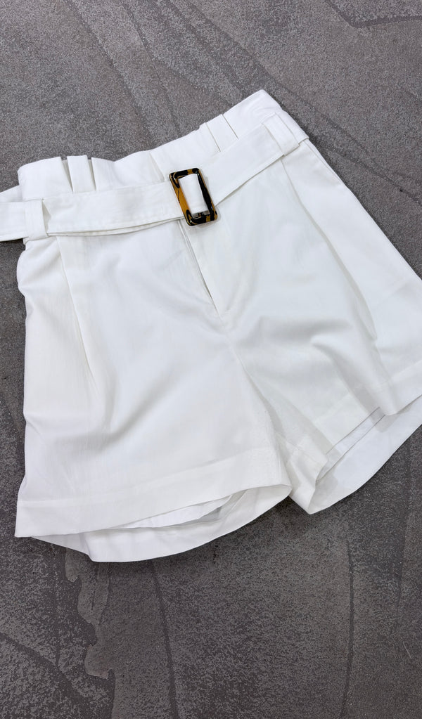 High-waisted white shorts with a belt