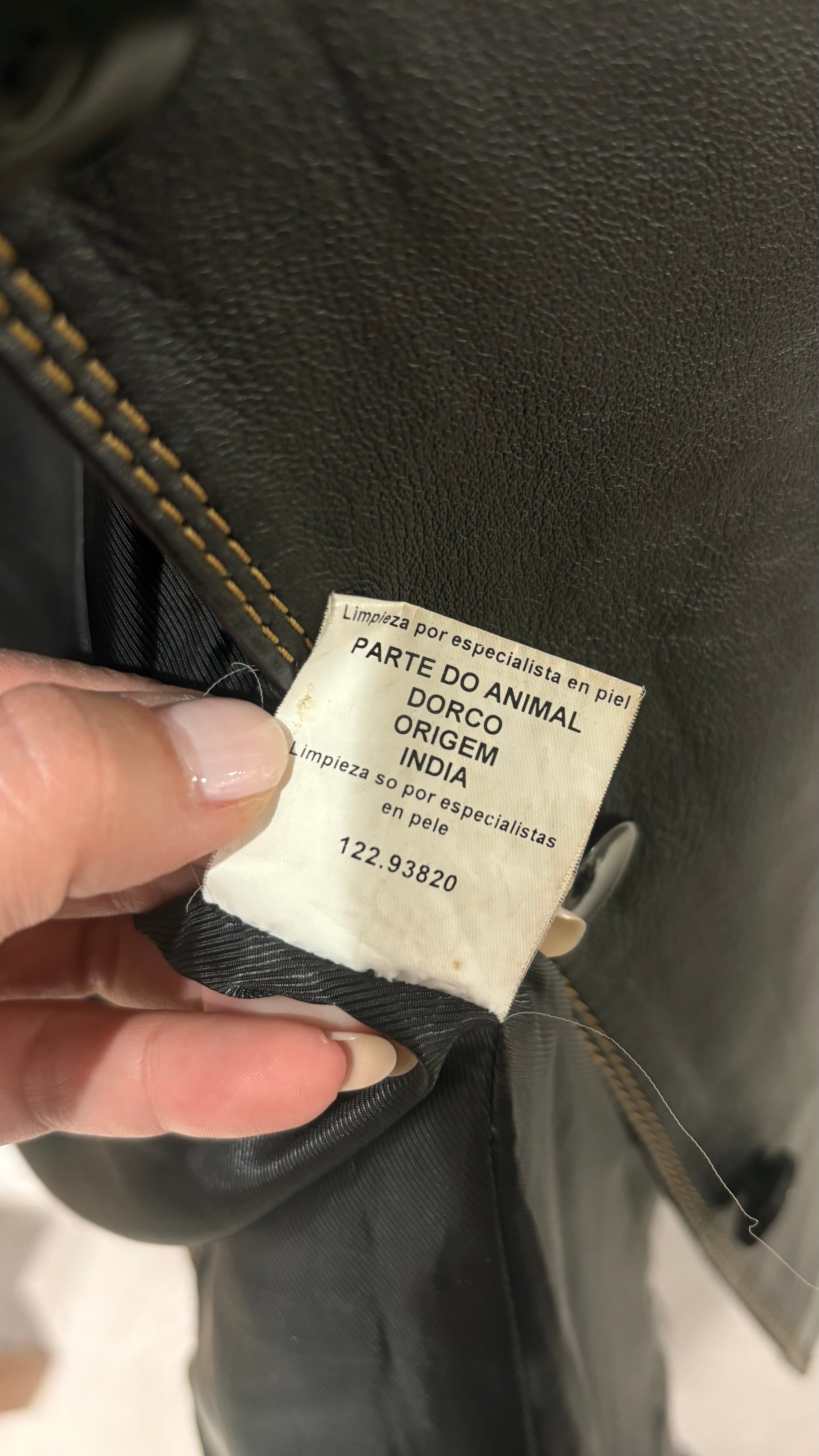 Black natural leather blazer with visible seam detailing and a cinched waist.