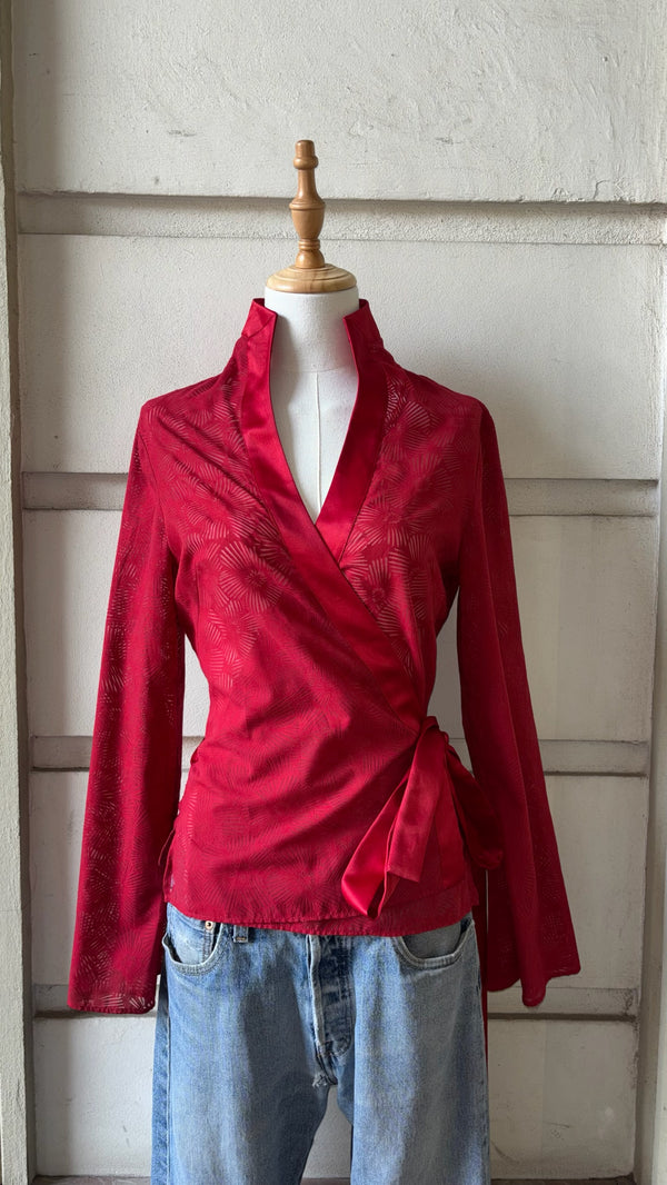 Red wrap blouse in an oriental style with a bow