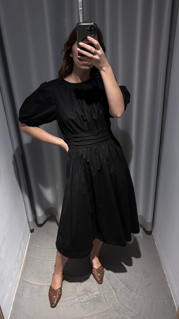 Black dress with defined waist and puff sleeves